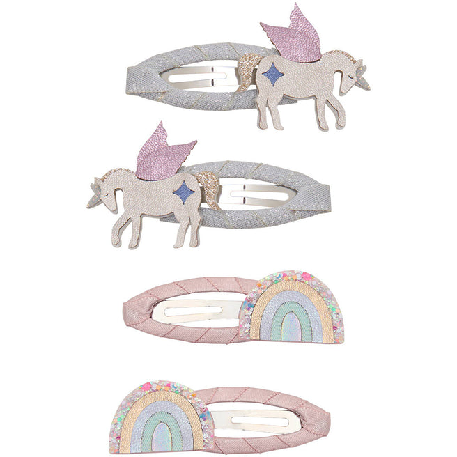 Vier mimi & lula haarclipjes voor kinderen, twee met eenhoorns en twee met regenbogen, liggend op een witte achtergrond.