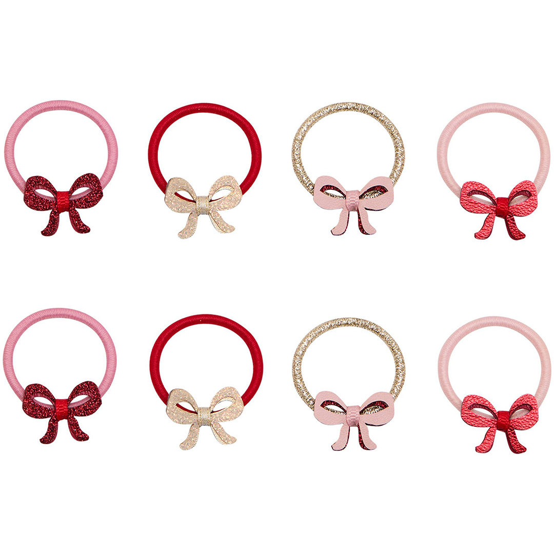 Mimi & Lula set van acht mini haarelastiekjes met strikjes in roze, rood en goud.