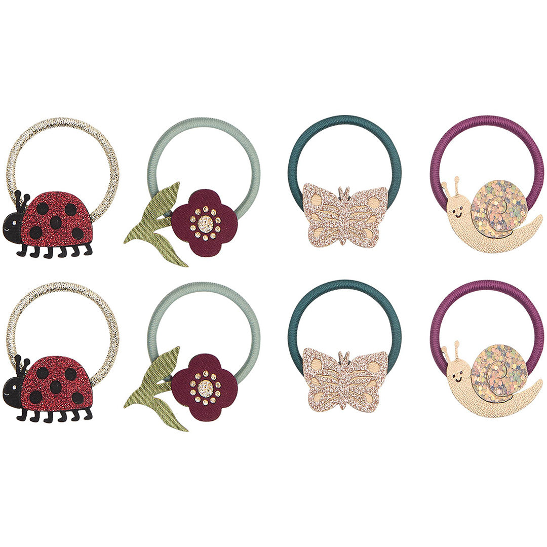 Acht mimi & lula haarelastiekjes met viltfiguren van lieveheersbeestjes, vlinders, slakken en bloemen.