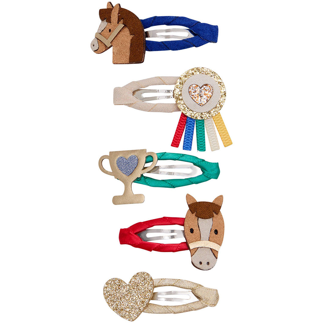Vijf mimi & lula kinder haarclipjes met paardenthema, waaronder paardenhoofden, een rozet, een trofee en een glitterhart.
