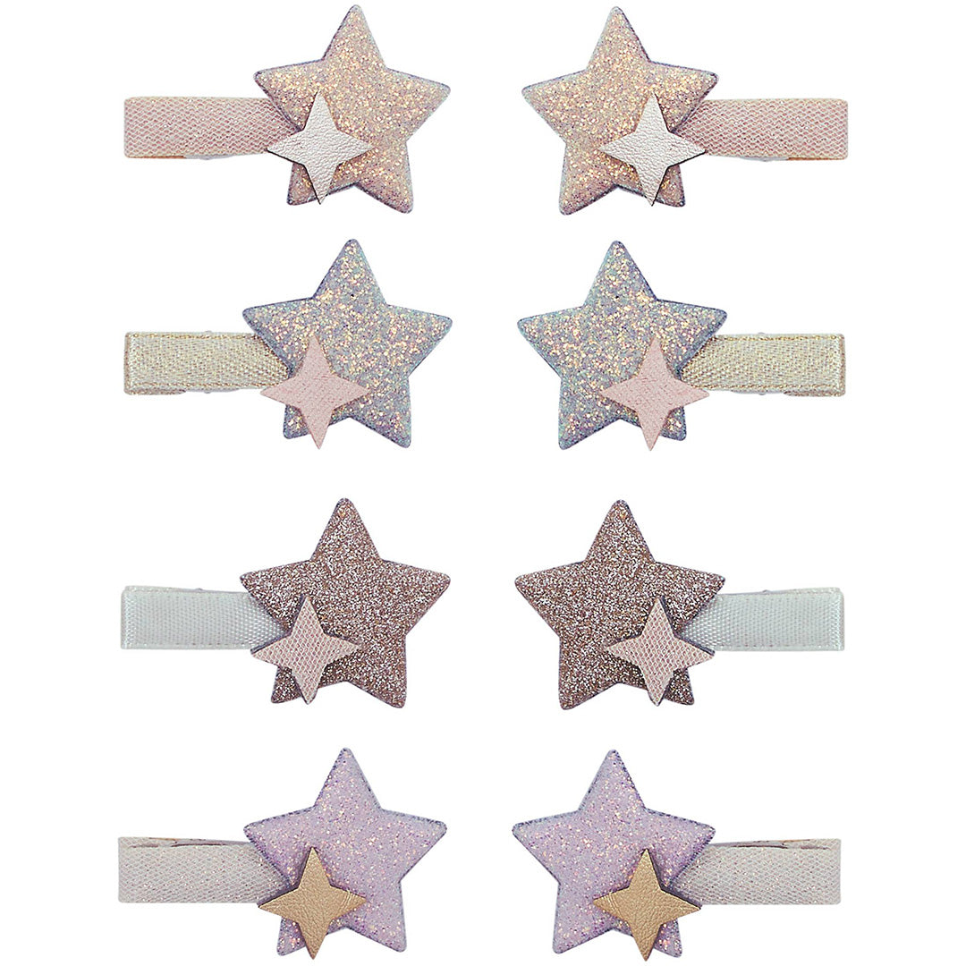 Acht mimi & lula haarclipjes voor kinderen in de vorm van glitterende sterren.