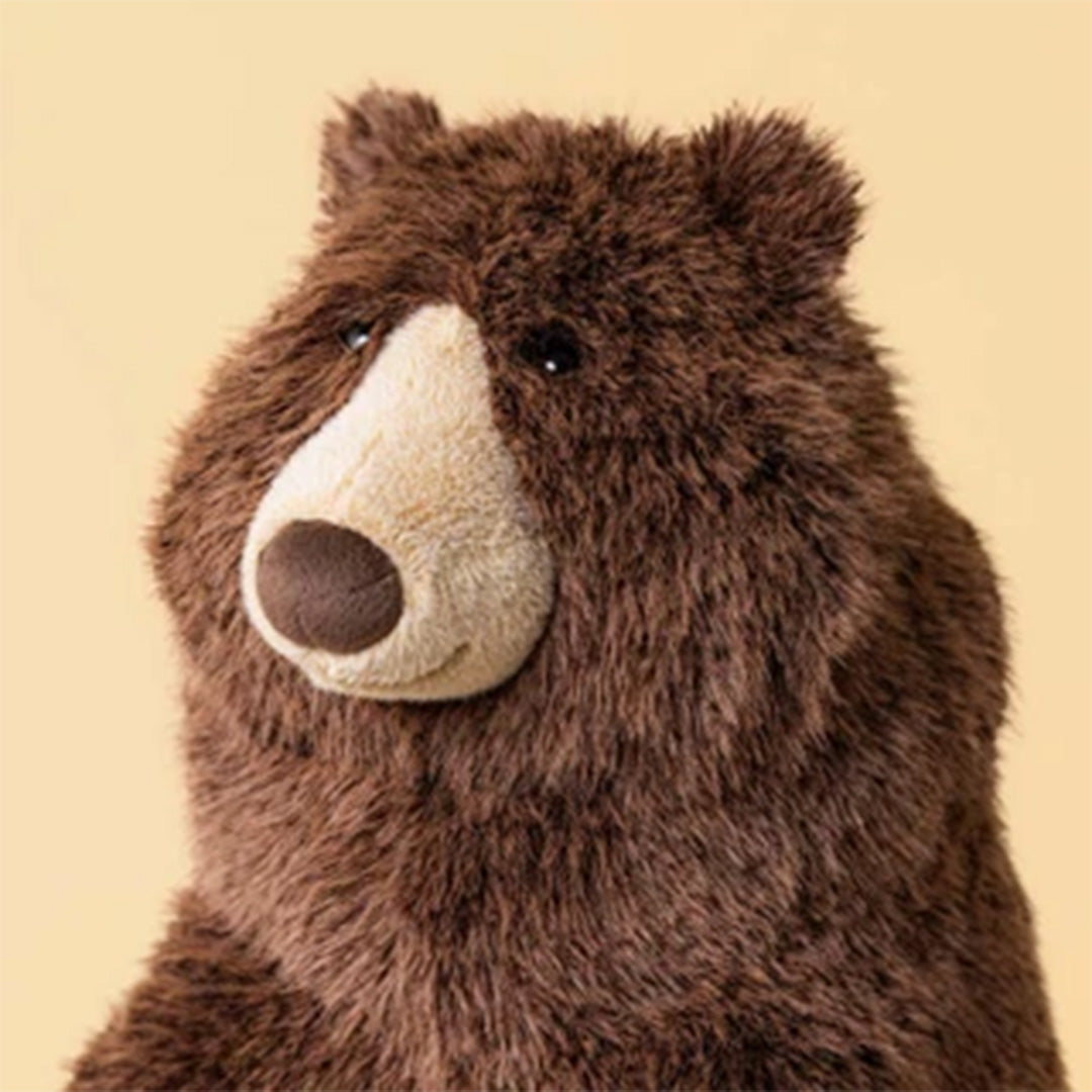 Detailfoto van de kop van de bruine Jellycat knuffelbeer Bizzlestomp.