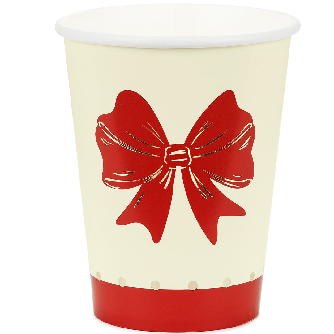 Partydeco papieren beker met rode strik en gouden stippen.