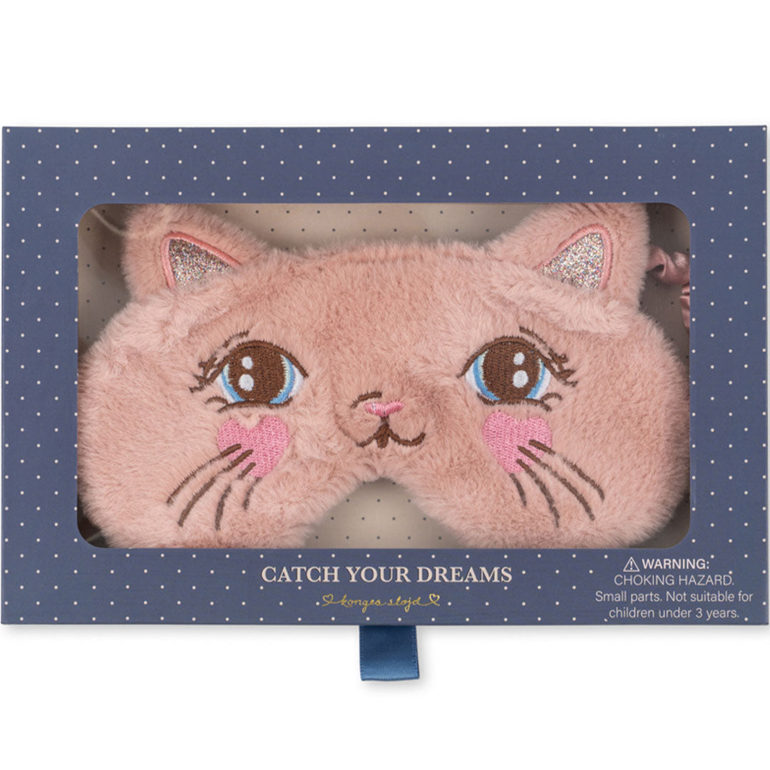 De verpakking van het Konges Sløjd roze katten slaapmasker, met een kijkvenster en de tekst 'Catch Your Dreams'.