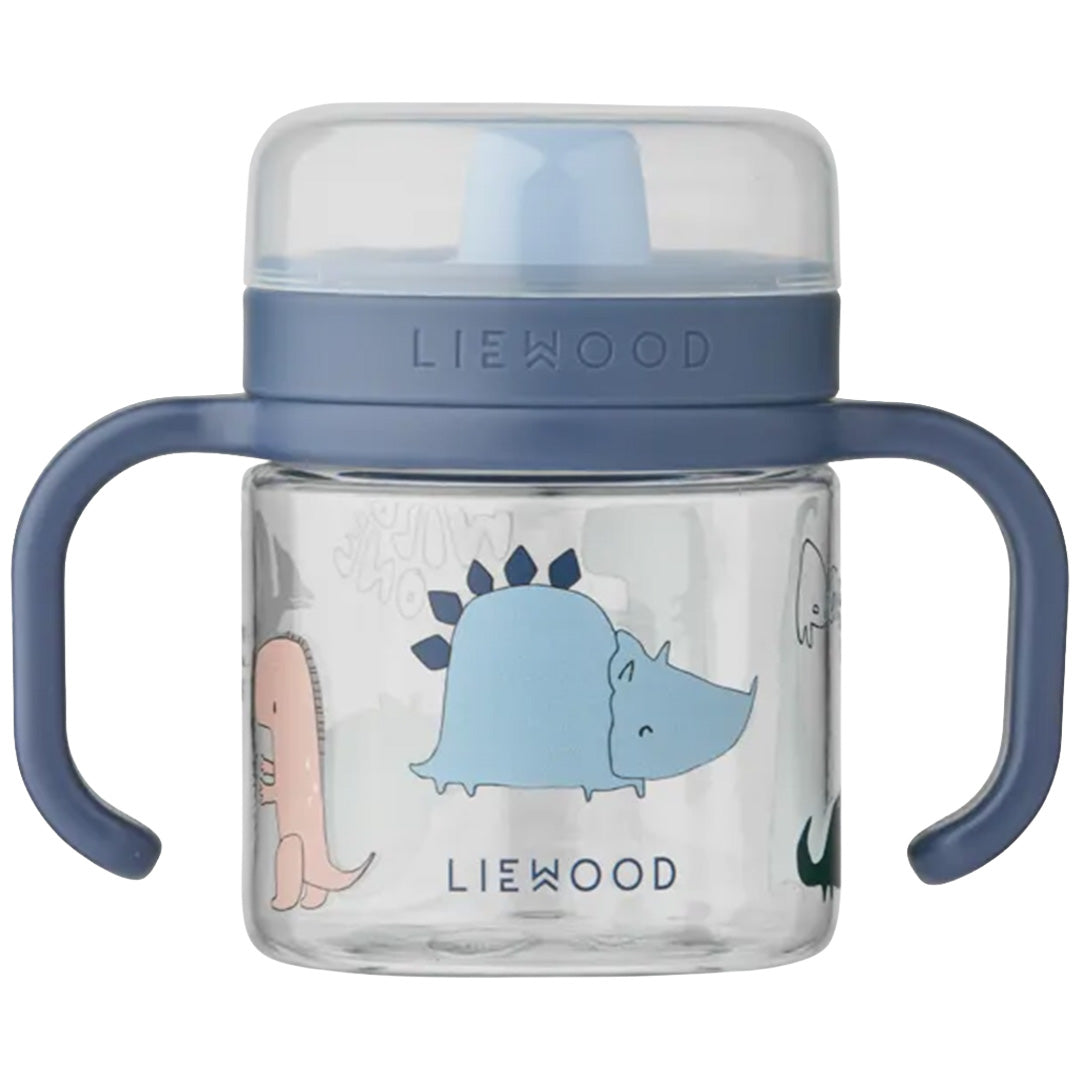 Liewood tuitbeker met blauwe dop en handvatten, versierd met dinosaurusfiguren.