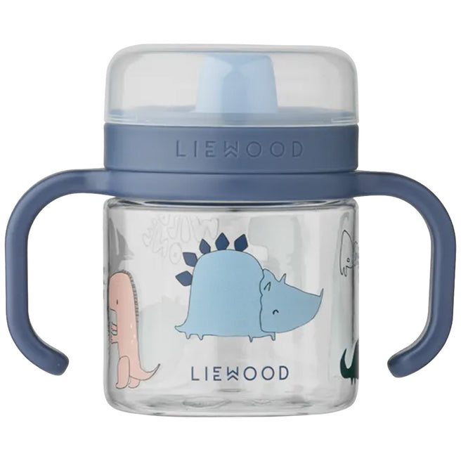 Liewood tuitbeker met blauwe dop en handvatten, versierd met dinosaurusfiguren.