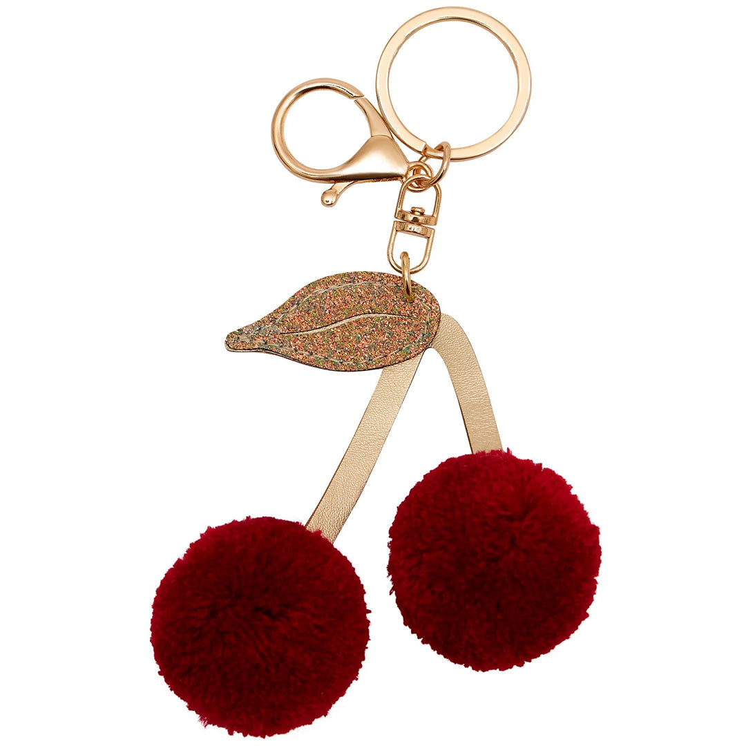 Mimi & Lula sleutelhanger met twee rode pompon kersen en een goudkleurig blad aan een metalen ring.