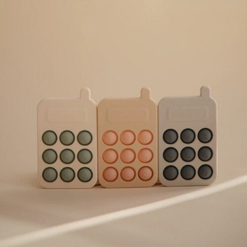 mushie sensorische speelgoedtelefoon - blush | 70.049.01 | 2