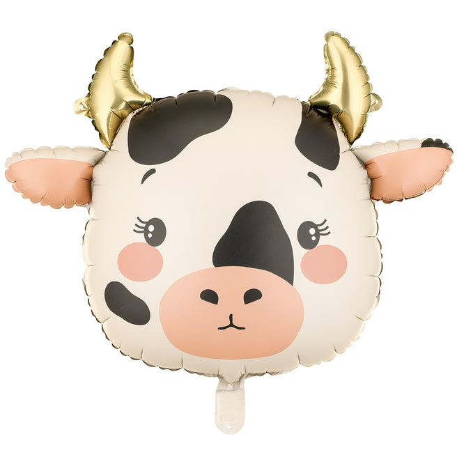 Partydeco folieballon in de vorm van een koeienhoofd met gouden hoorns.