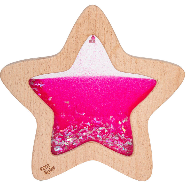 Petit Boum houten sensorische ster met roze vloeistof en glitters.